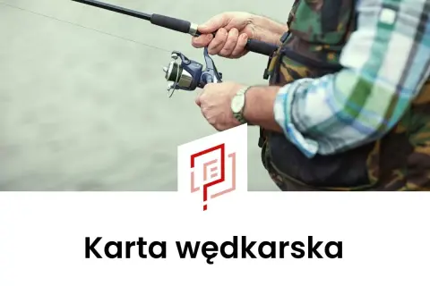 Ręce wędkarza trzymające wędkę i kołowrotek.